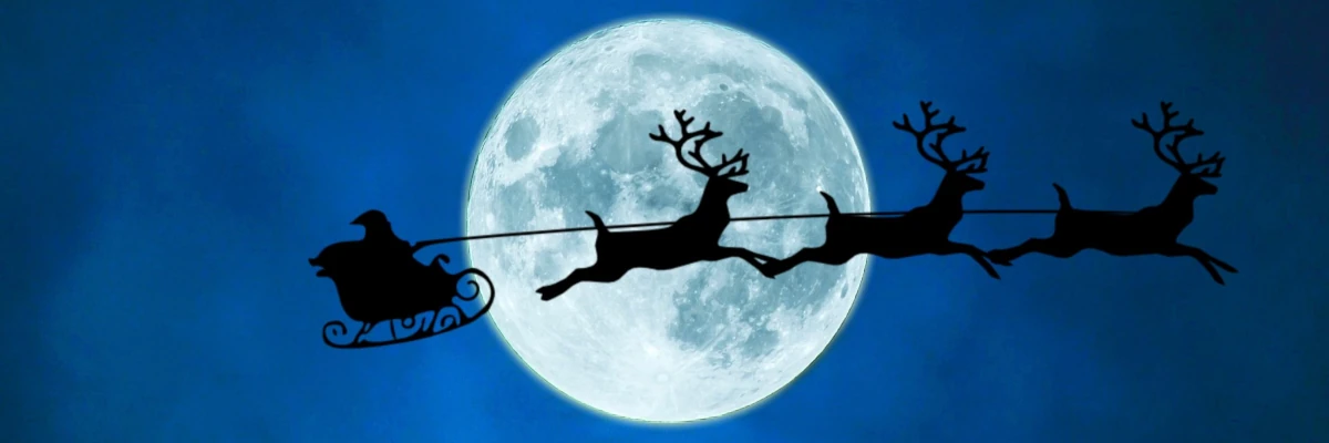 Questo Natale, donati e dona un regalo elettrico Profilo di Babbo Natale che con slitta e renne vola nel cielo notturno davanti alla luna. Questo Natale, donati e dona un regalo elettrico