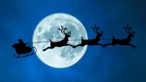 Profilo di Babbo Natale che con slitta e renne vola nel cielo notturno davanti alla luna. Questo Natale, donati e dona un regalo elettrico